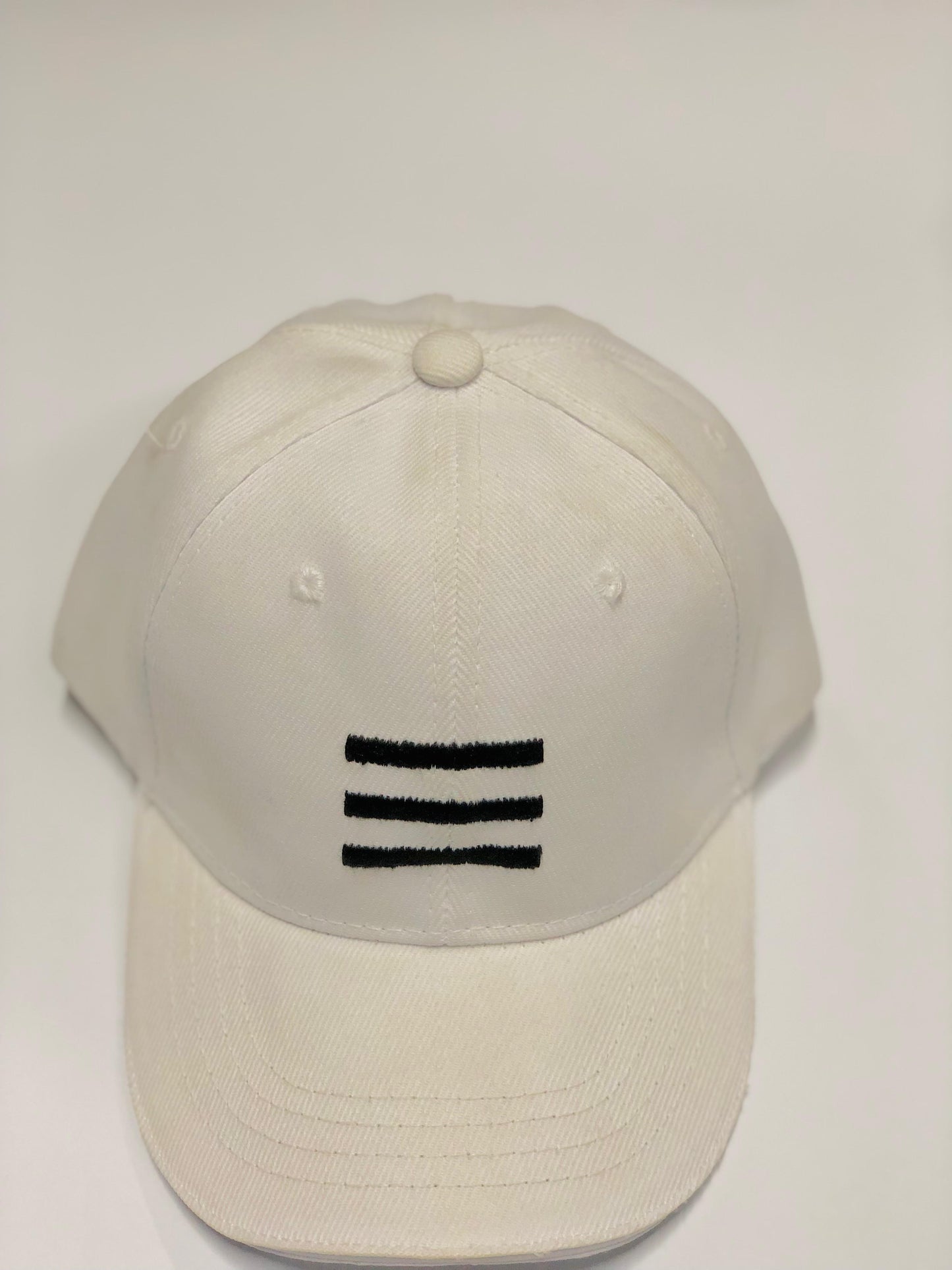 White three bar imported cap